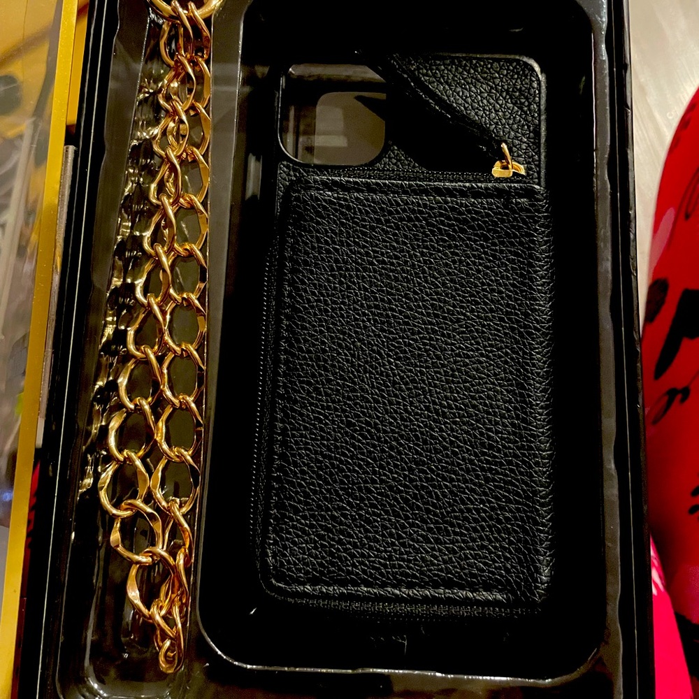 Black wristlet case with gold chain for I 11/XR